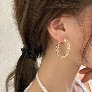 GOLD TWISTED HOOPS